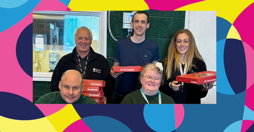SCB service users and Cartridge People staff with pizzas.