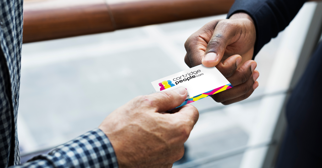 Someone handing someone else a business card.