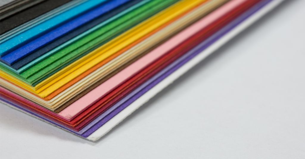 Pile of cardstock in assorted colours.