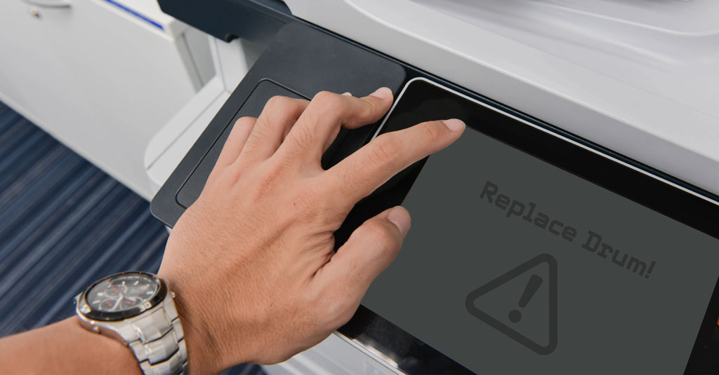 A printer screen displaying the words: 'Replace Drum!'