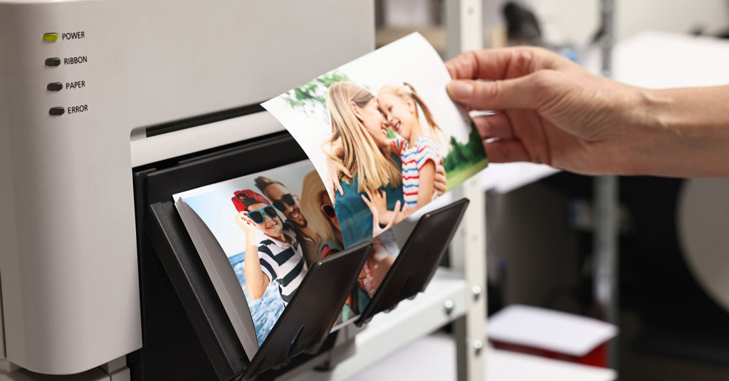 Photos being printed on a home printer